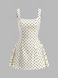 Robe à pois et dos lacé