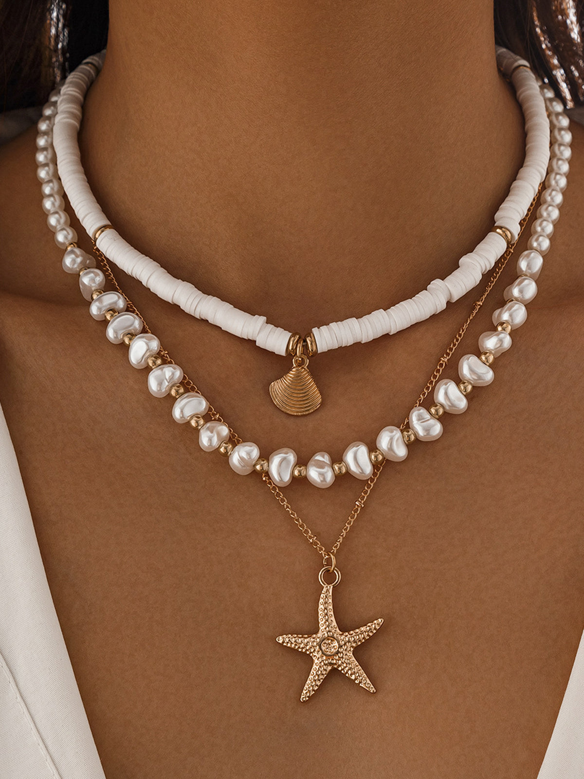 Collier à plusieurs rangs de perles et de coquillages avec pendentif étoile de mer 