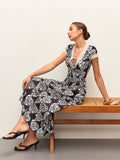 Robe à imprimé floral, col en V et nœud à nouer
