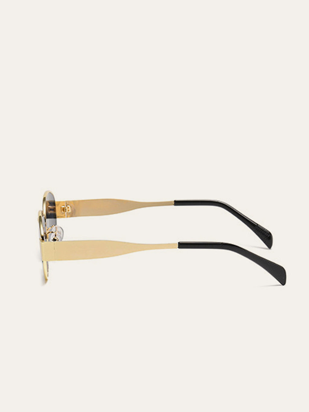 Lunettes de soleil ovales à monture dorée