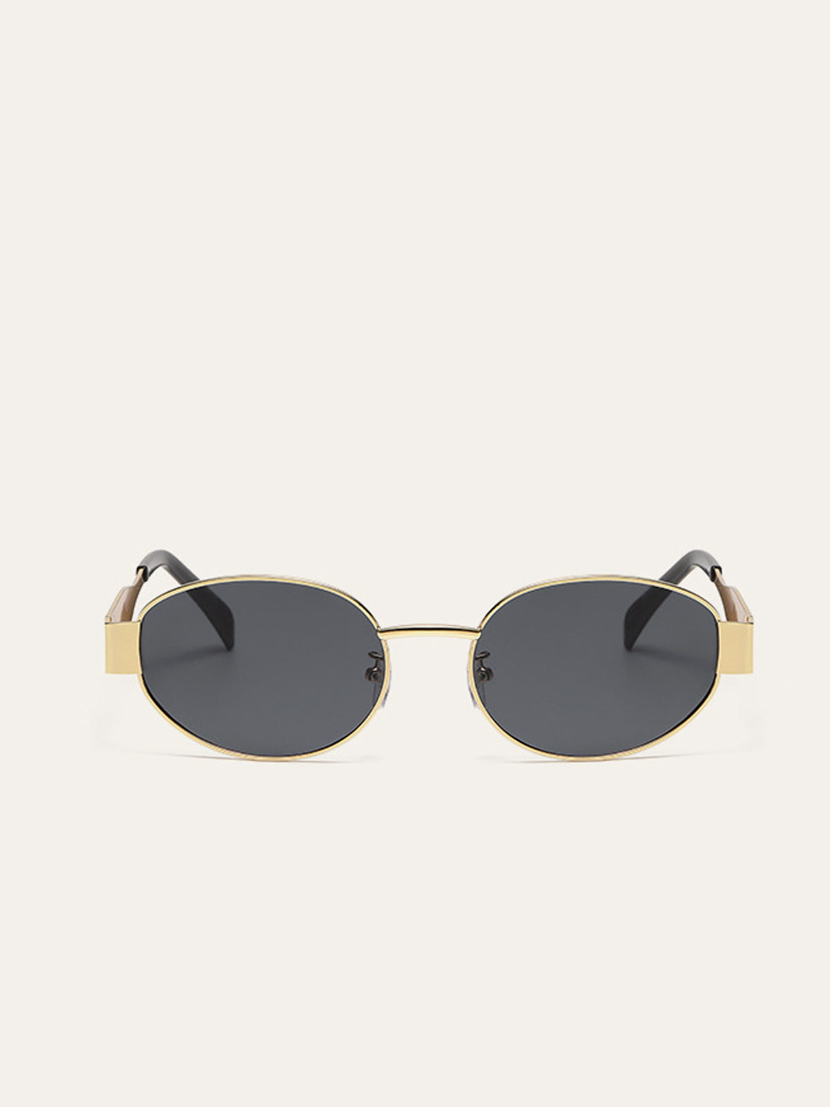 Lunettes de soleil ovales à monture dorée