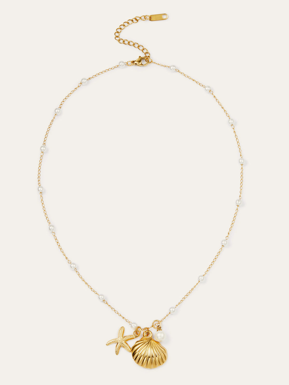 Halskette mit goldener Muschel und Seestern mit Perlen
