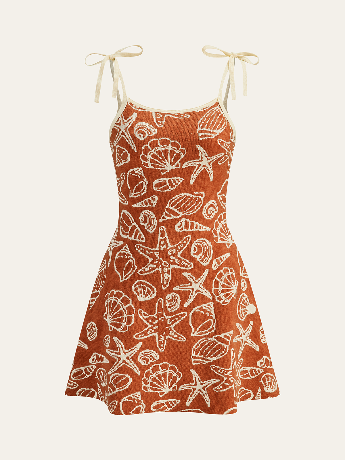 Minikleid mit Muschelmuster und Bindeträgern