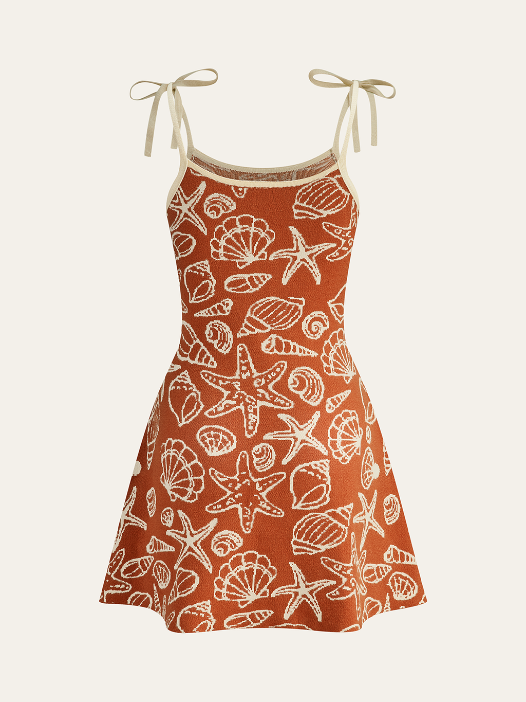 Minikleid mit Muschelmuster und Bindeträgern