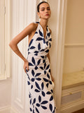 Robe longue dos nu semi-transparente à col licou