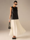 Zweifarbiges Kleid aus Kunstleder und Chiffon mit Faltenrock