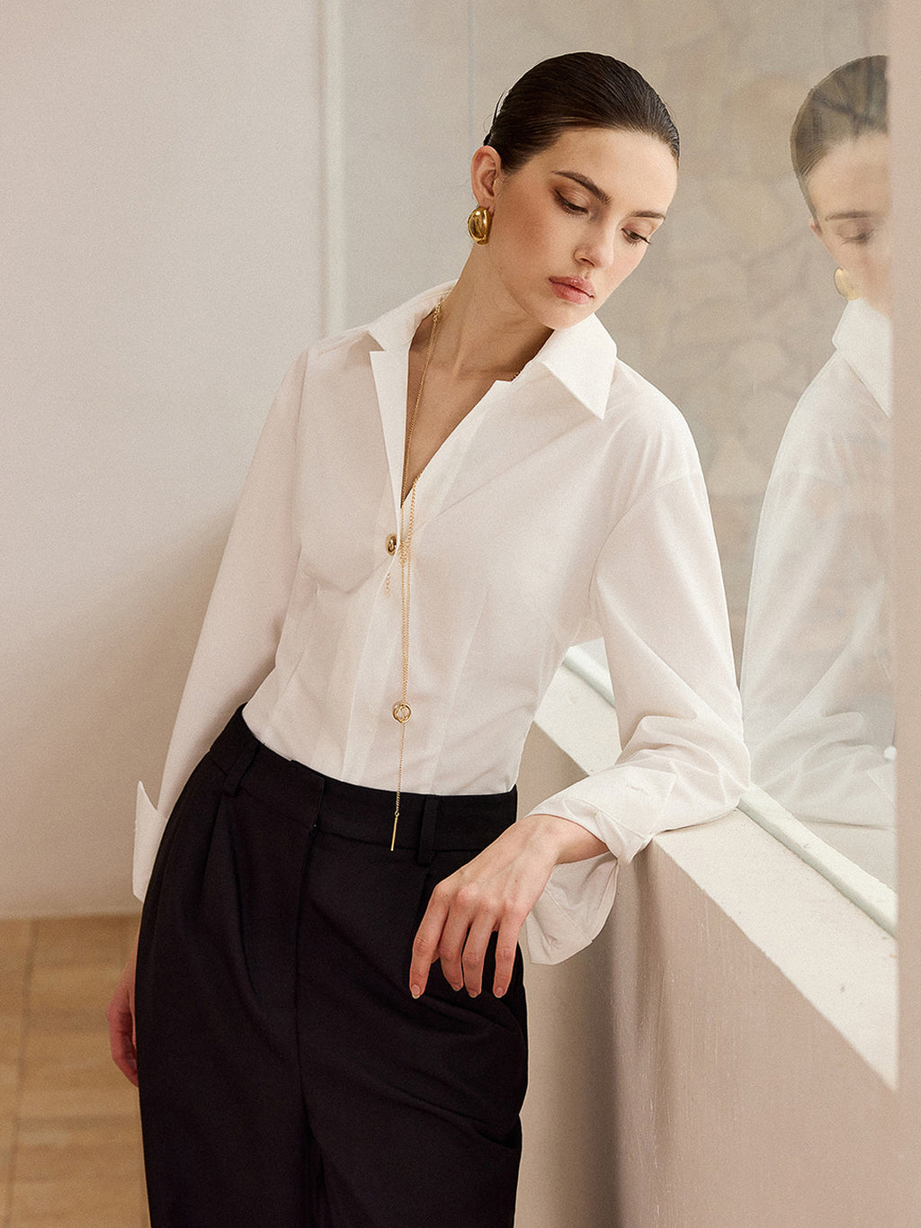 Chemise à manches longues et boutons métalliques