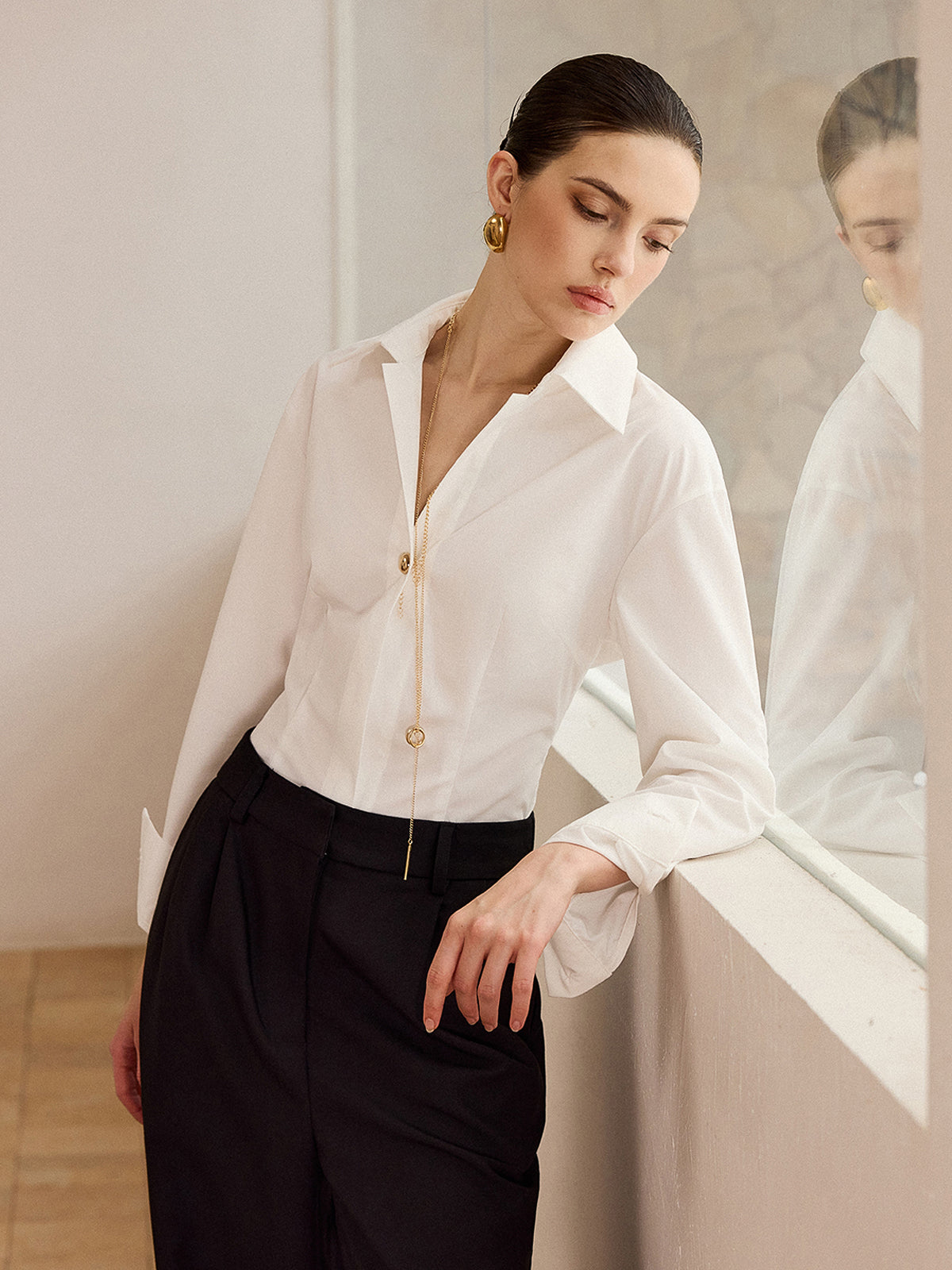 Chemise à manches longues avec boutons métalliques 