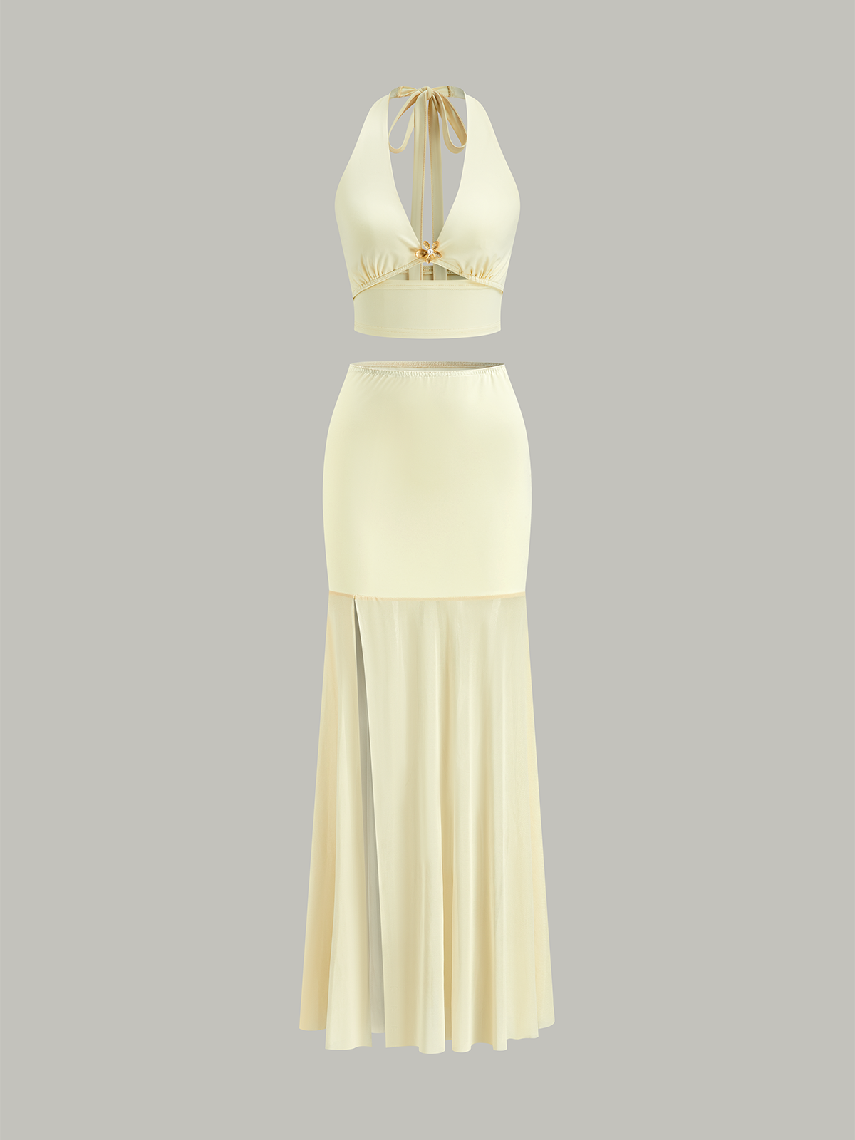 Ensemble haut court dos nu et jupe à empiècements en résille 