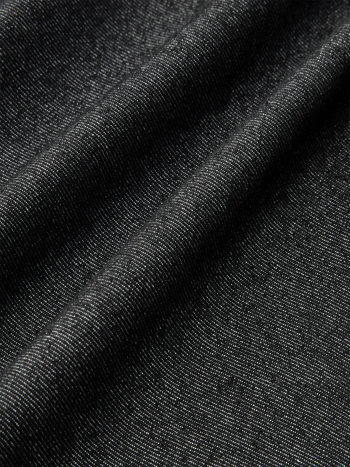 Mini-jupe asymétrique à poches boutonnées sur le devant 