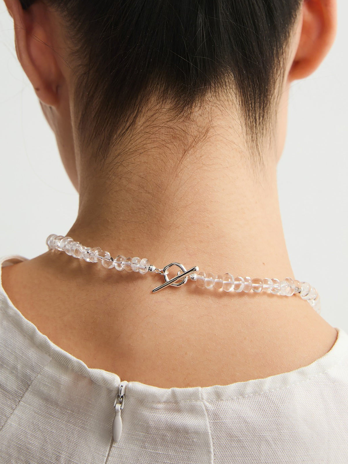 Clear Crystal Beaded Necklace with Green Gemstone Accent