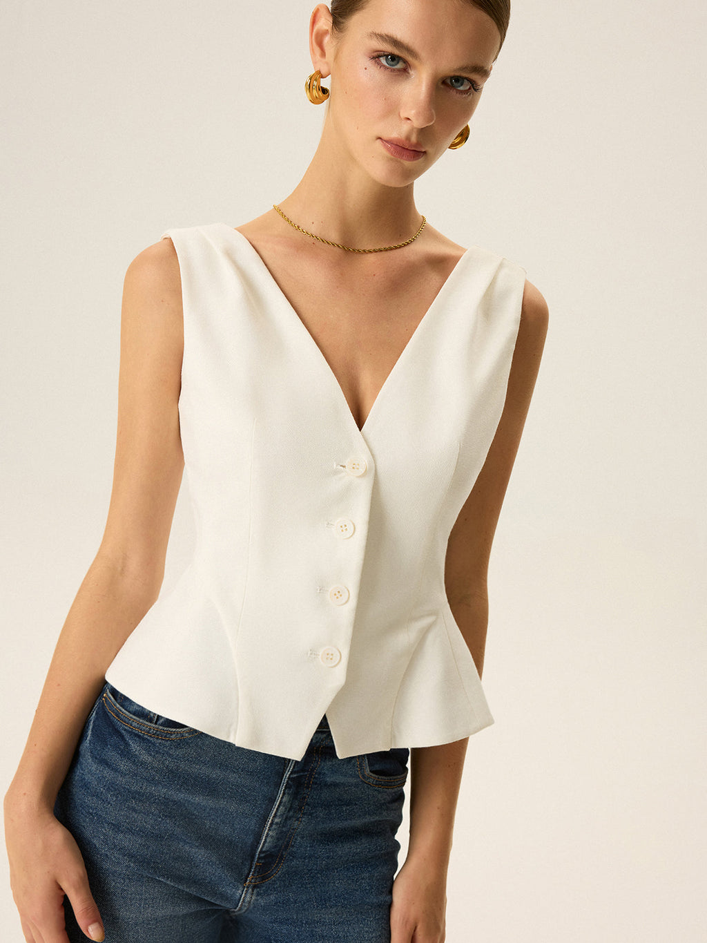 Gilet péplum boutonné sur le devant