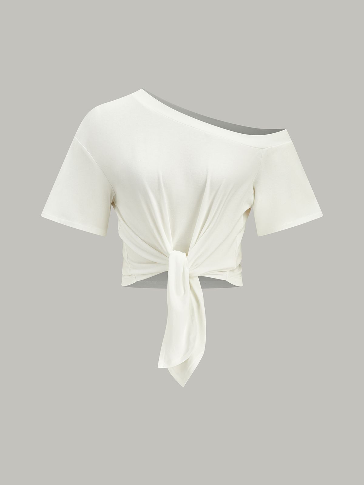 Haut asymétrique à nœud sur une épaule 