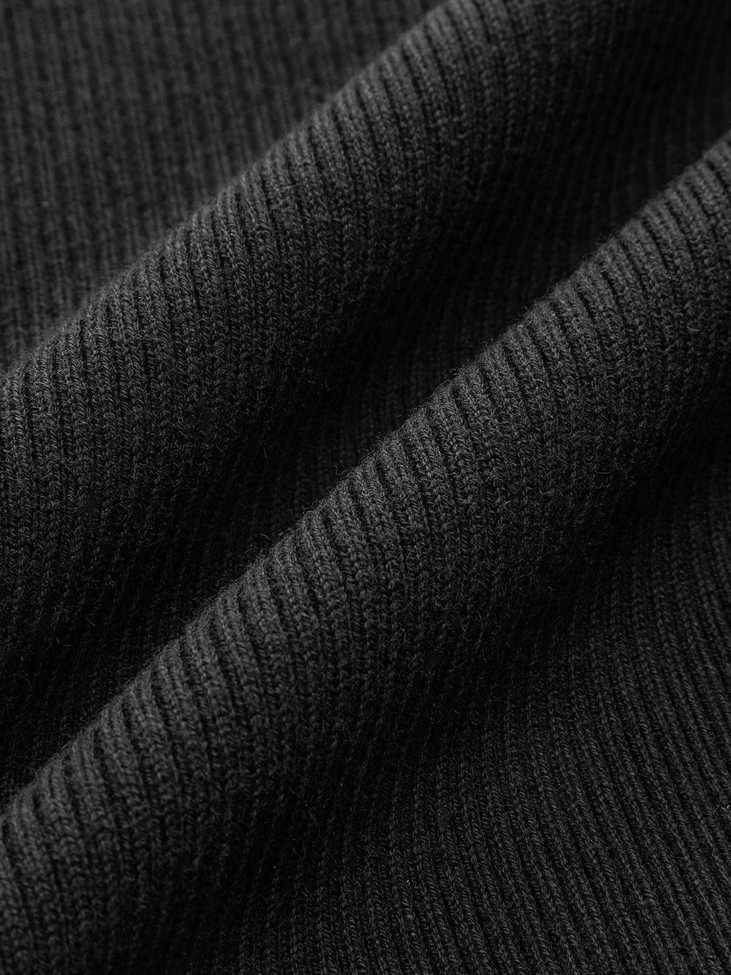 Stricktop aus Wolle mit Schößchen und Metallknöpfen