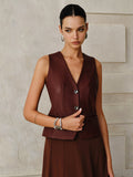 Gilet en similicuir à boutons métalliques