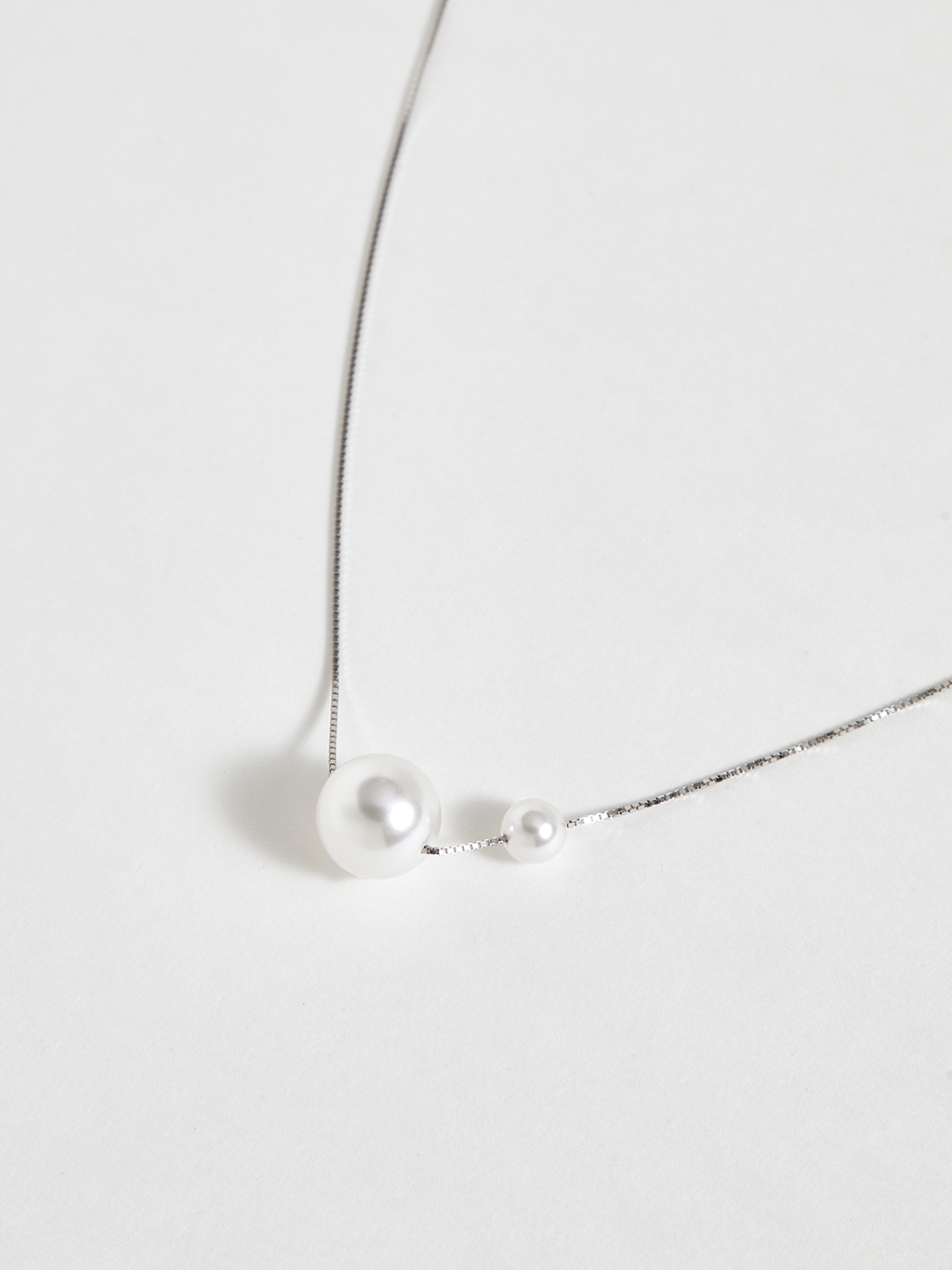 Collier pendentif double perle