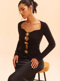 Oberteil aus Strick mit Metalldetails und Cut-Outs