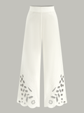 Pantalon large brodé à découpes