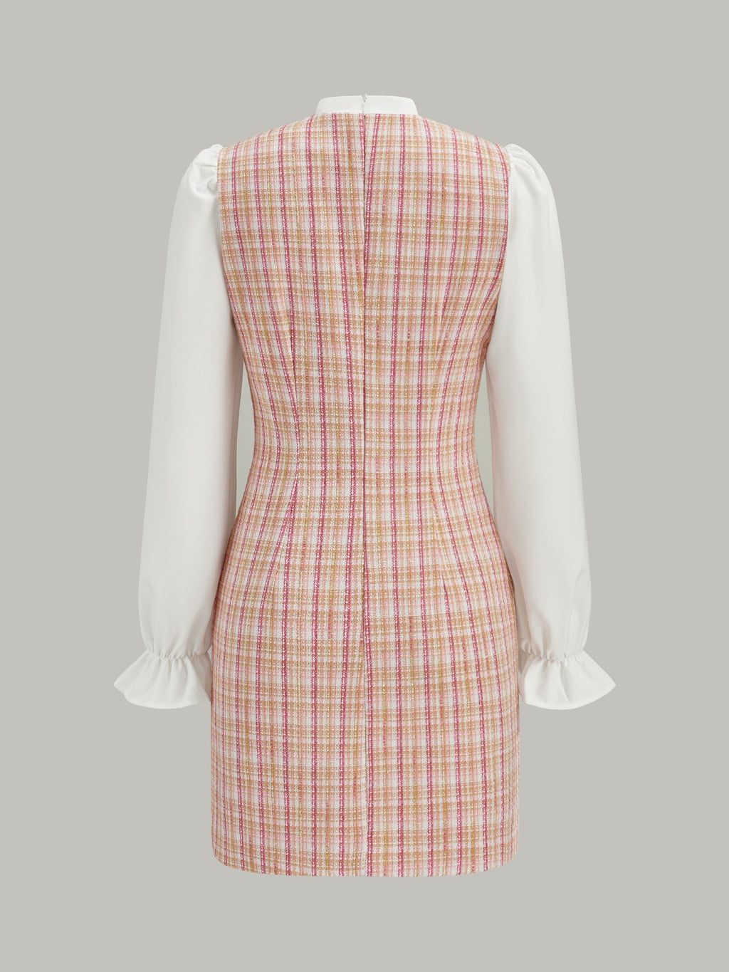 Mini-robe en tweed avec empiècements et décolleté nœud papillon