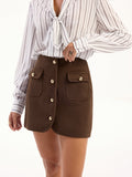 Mini-jupe en tweed avec boutons décoratifs et poches