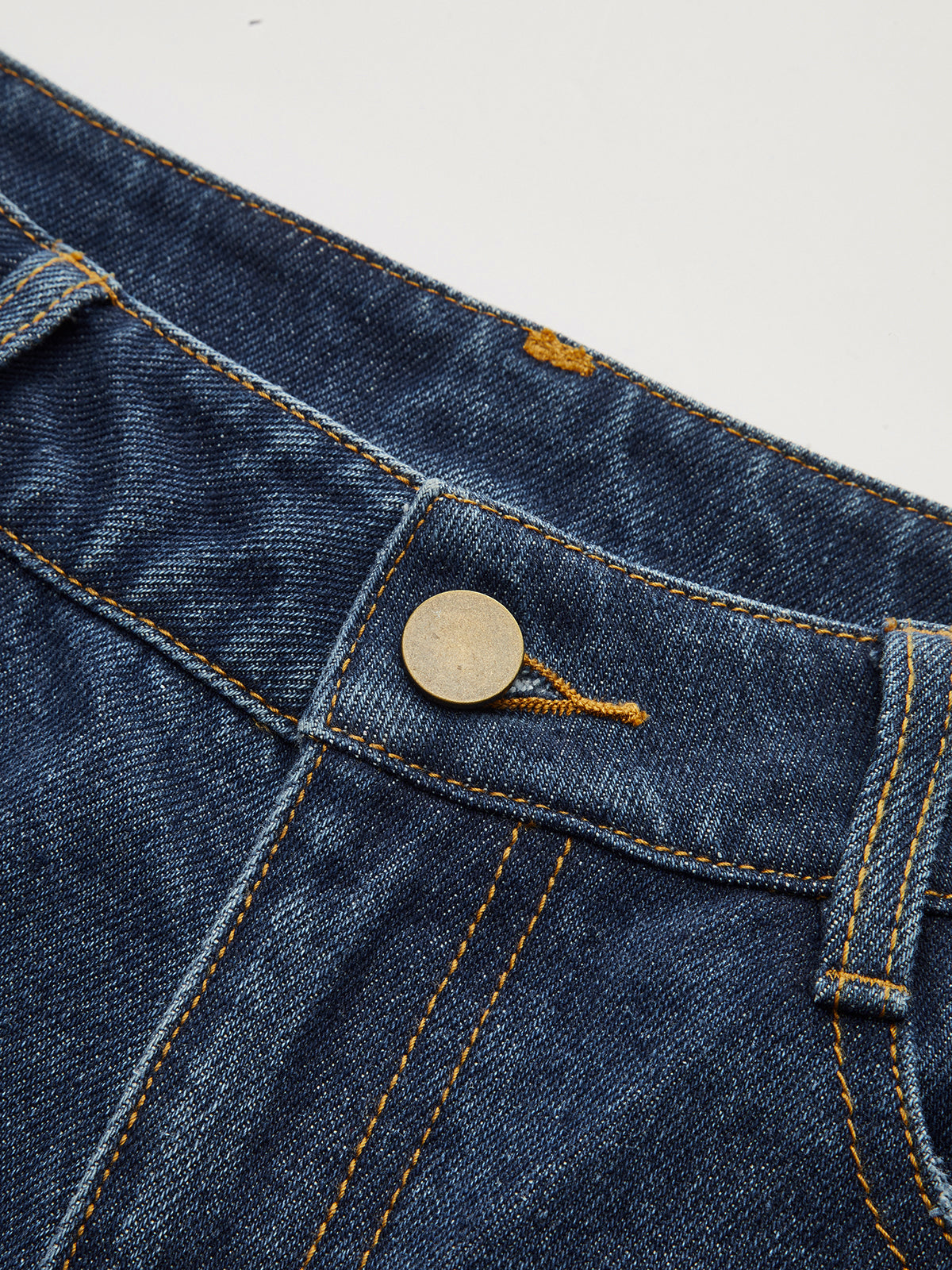 Pantalon en denim taille mi-haute à jambes incurvées 