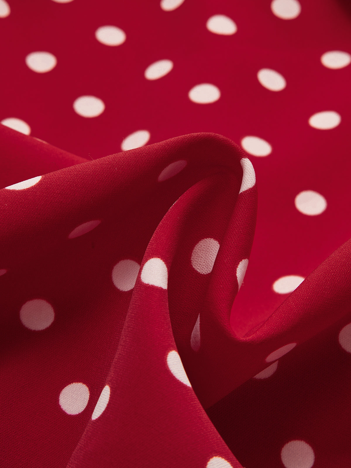 Ensemble haut et jupe à pois et rosettes 