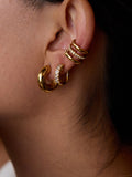 Boucles d'oreilles clips serpentées ornées de cristaux