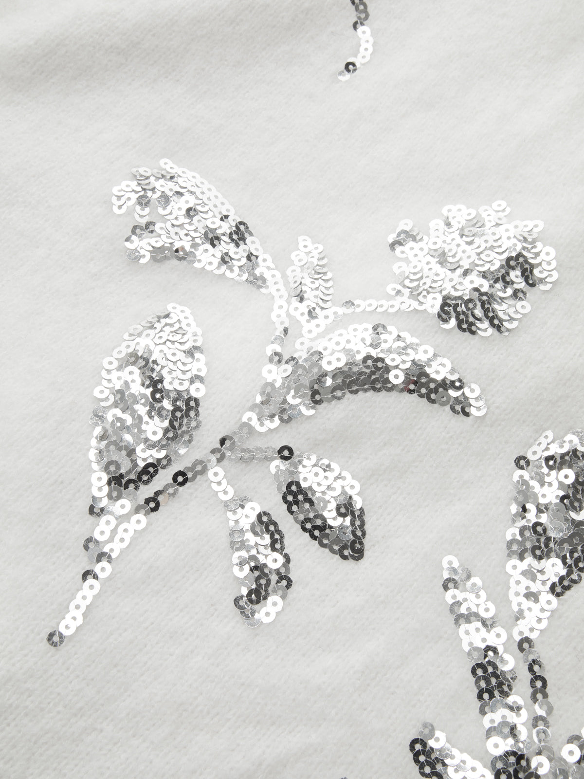 Pull oversize à sequins et fleurs 