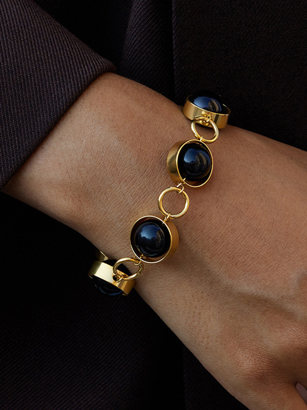 Bracelet avec fermoir mousqueton perle noire rotative