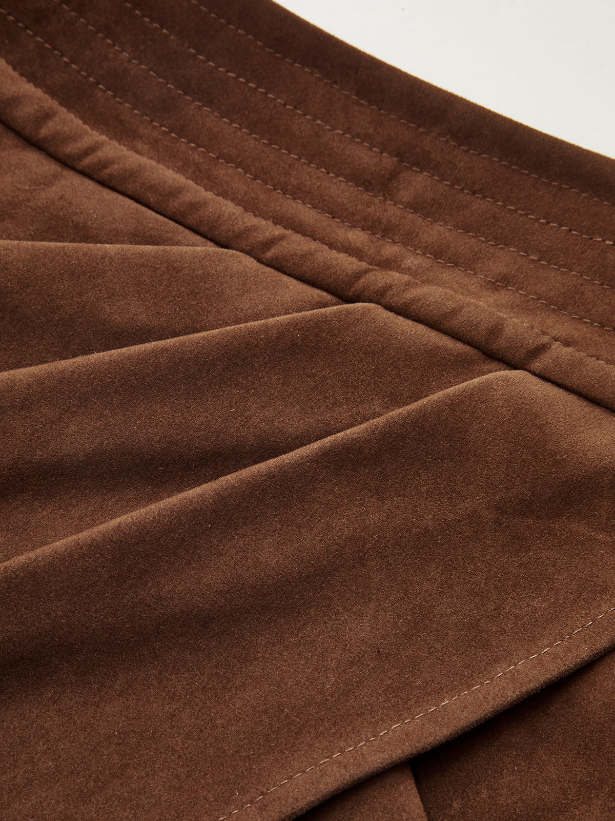 Mini-jupe asymétrique plissée effet daim 