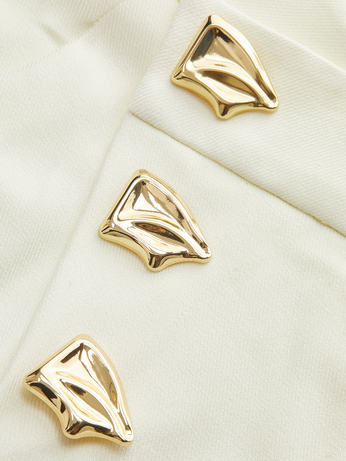 Pantalon à jambes larges asymétrique taille mi-haute avec détails métalliques 