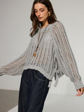 Pull oversize en maille ajourée à nouer sur le côté