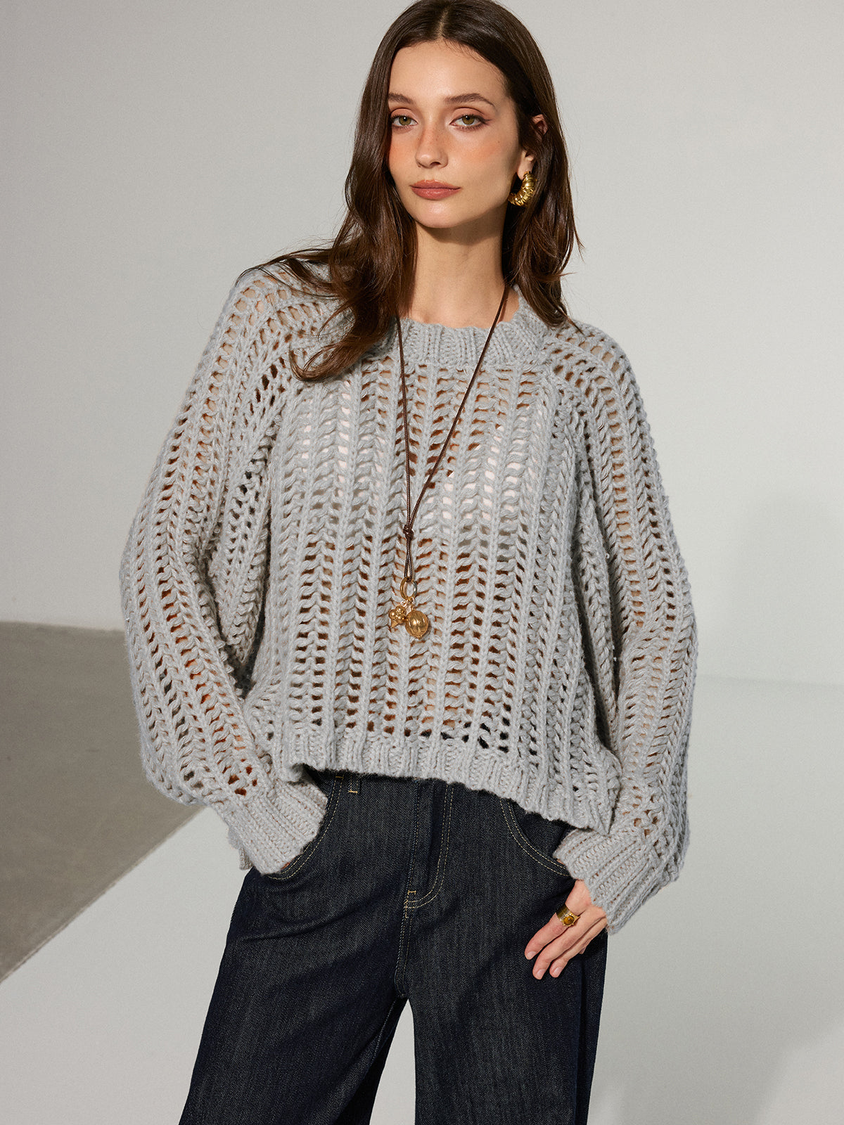 Pull oversize en maille ajourée à nouer sur le côté