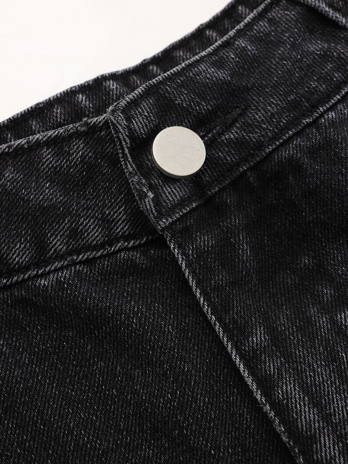Jean en denim délavé à jambes incurvées