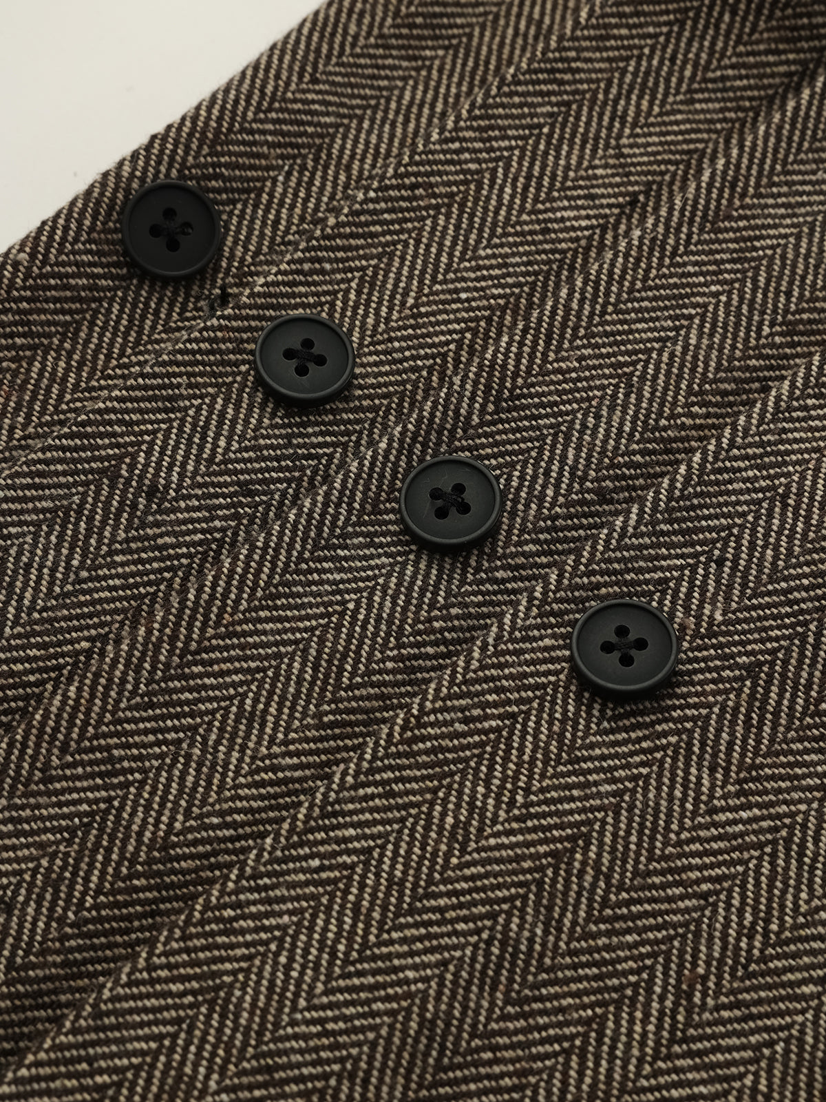 Pantalon plissé droit en tweed à chevrons