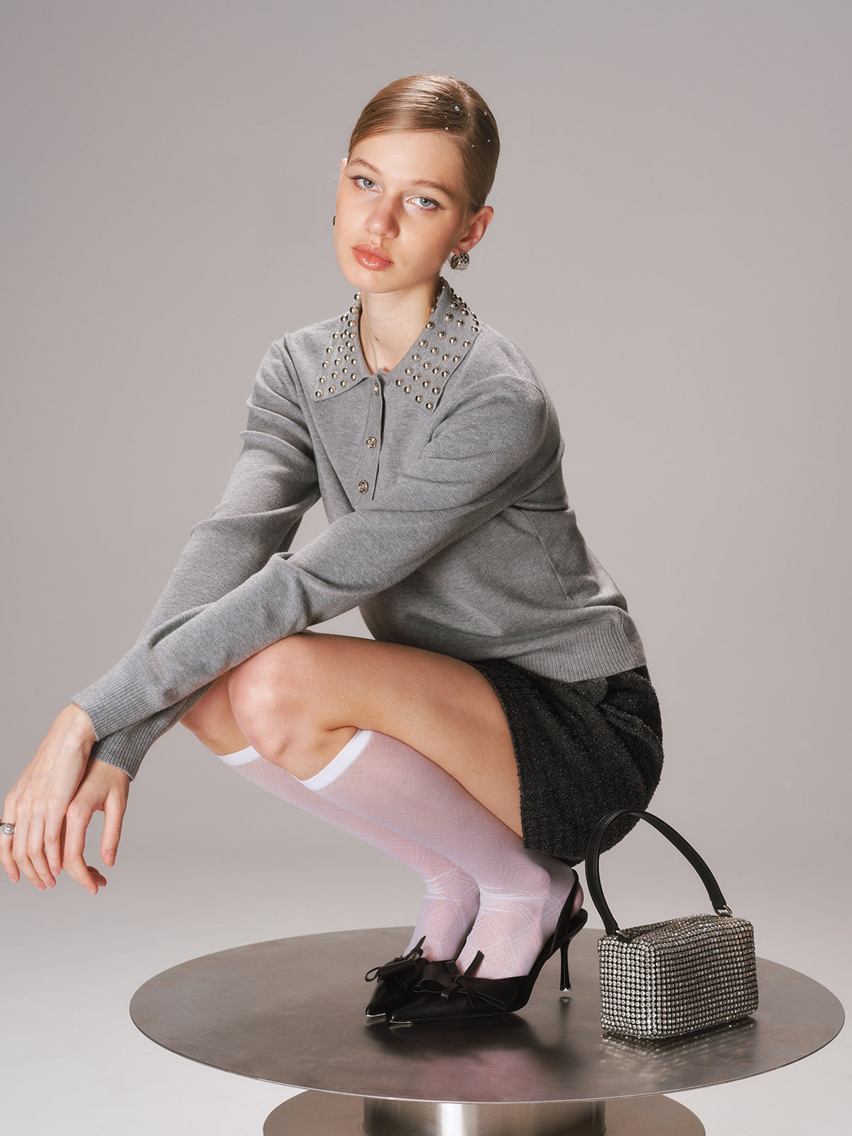 Polo en tricot mélangé de laine à col clouté