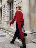 Pull asymétrique drapé en maille torsadée mélangée de laine