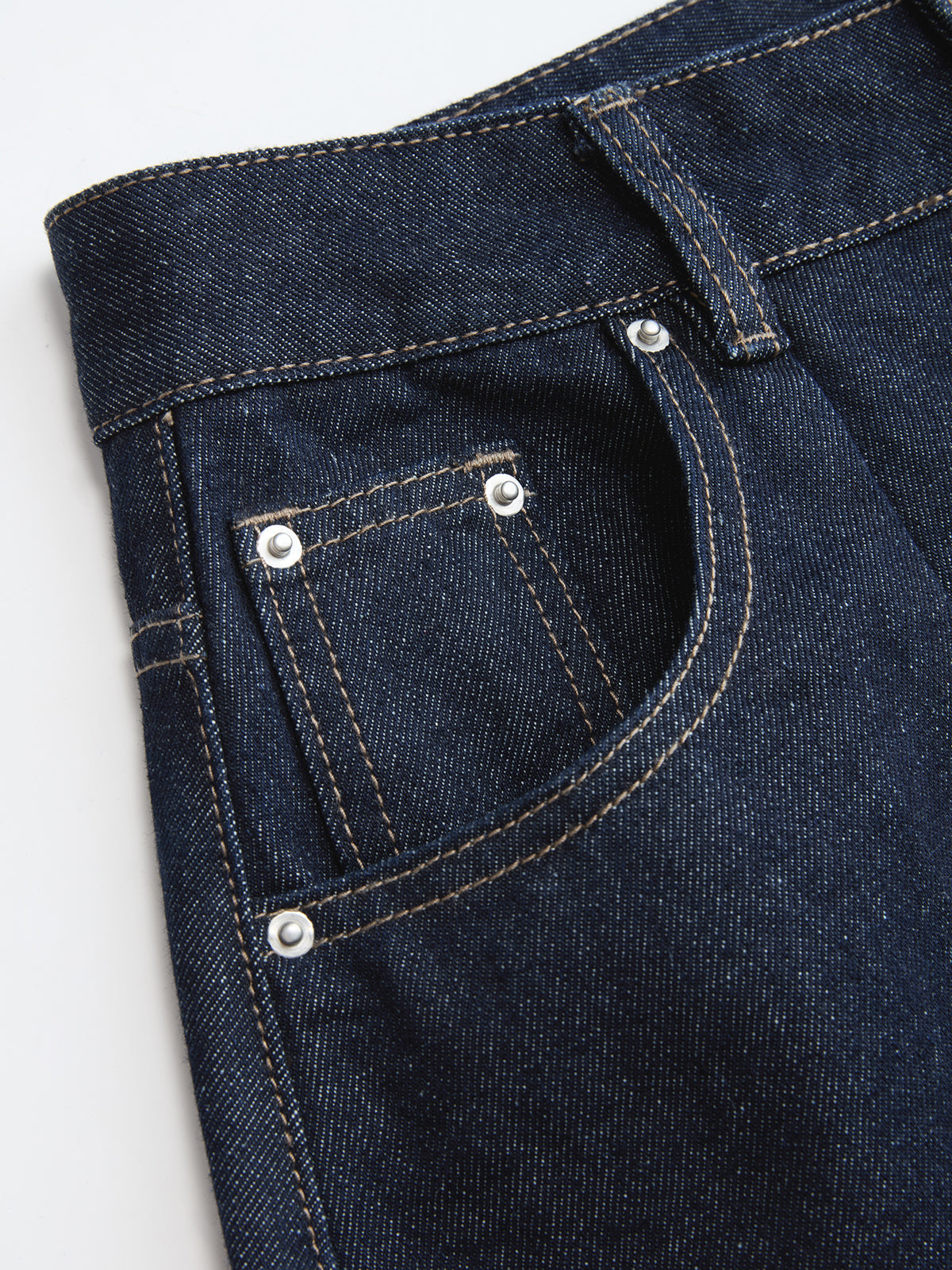 Jeans à jambes incurvées, taille mi-haute, boutonnés sur le devant