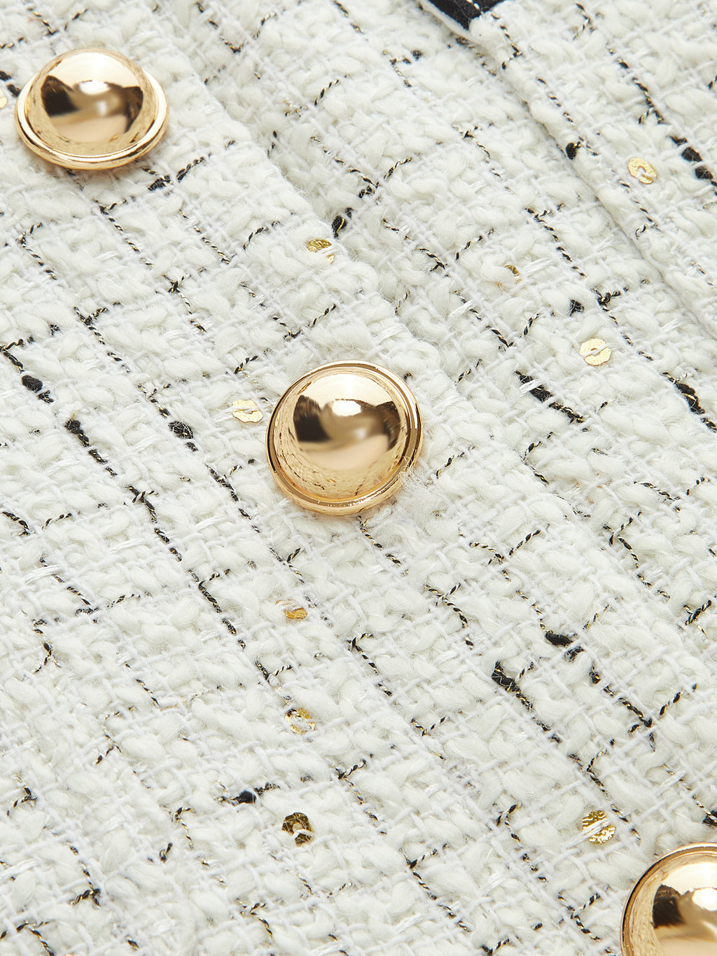 Mini-jupe en tweed à bordures contrastantes