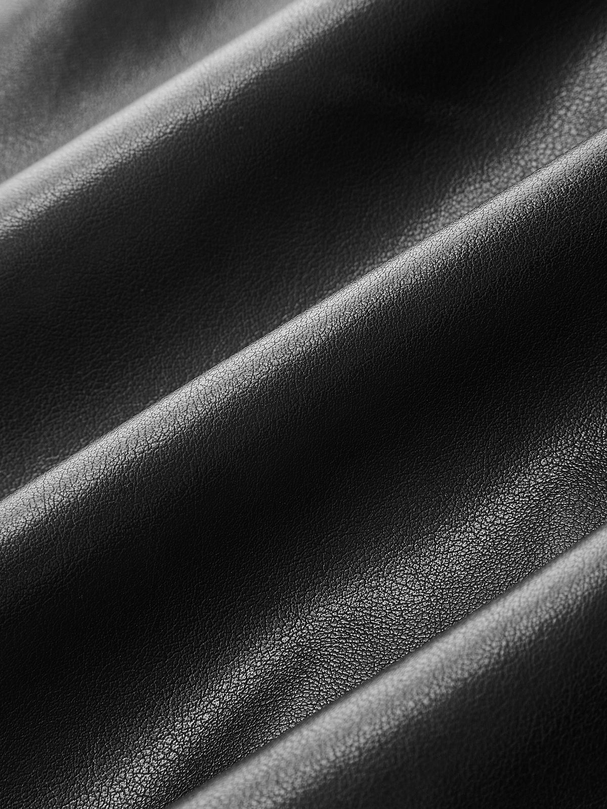 Robe longue asymétrique en maille et similicuir