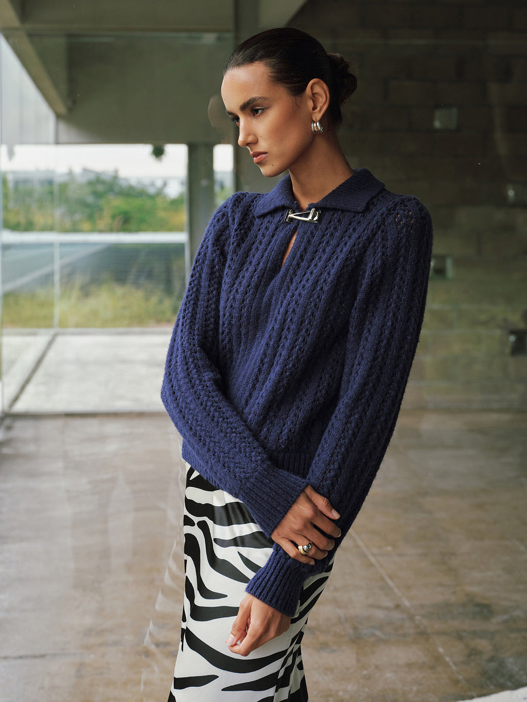 Pull col polo torsadé avec boucle