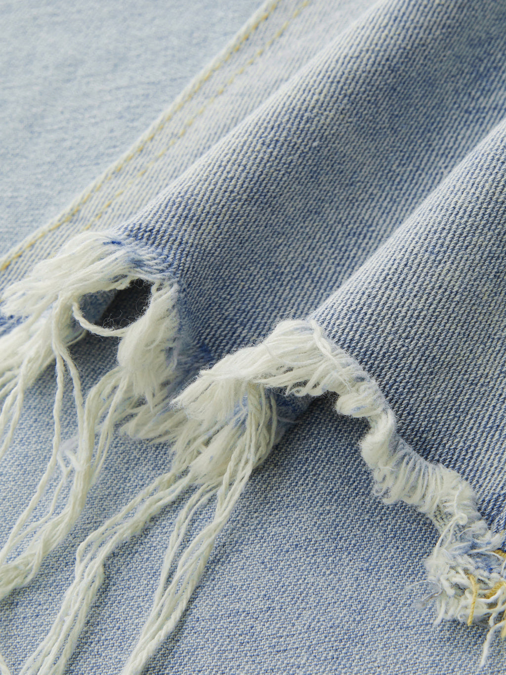 Asymmetrischer Denim-Fransen-Midirock