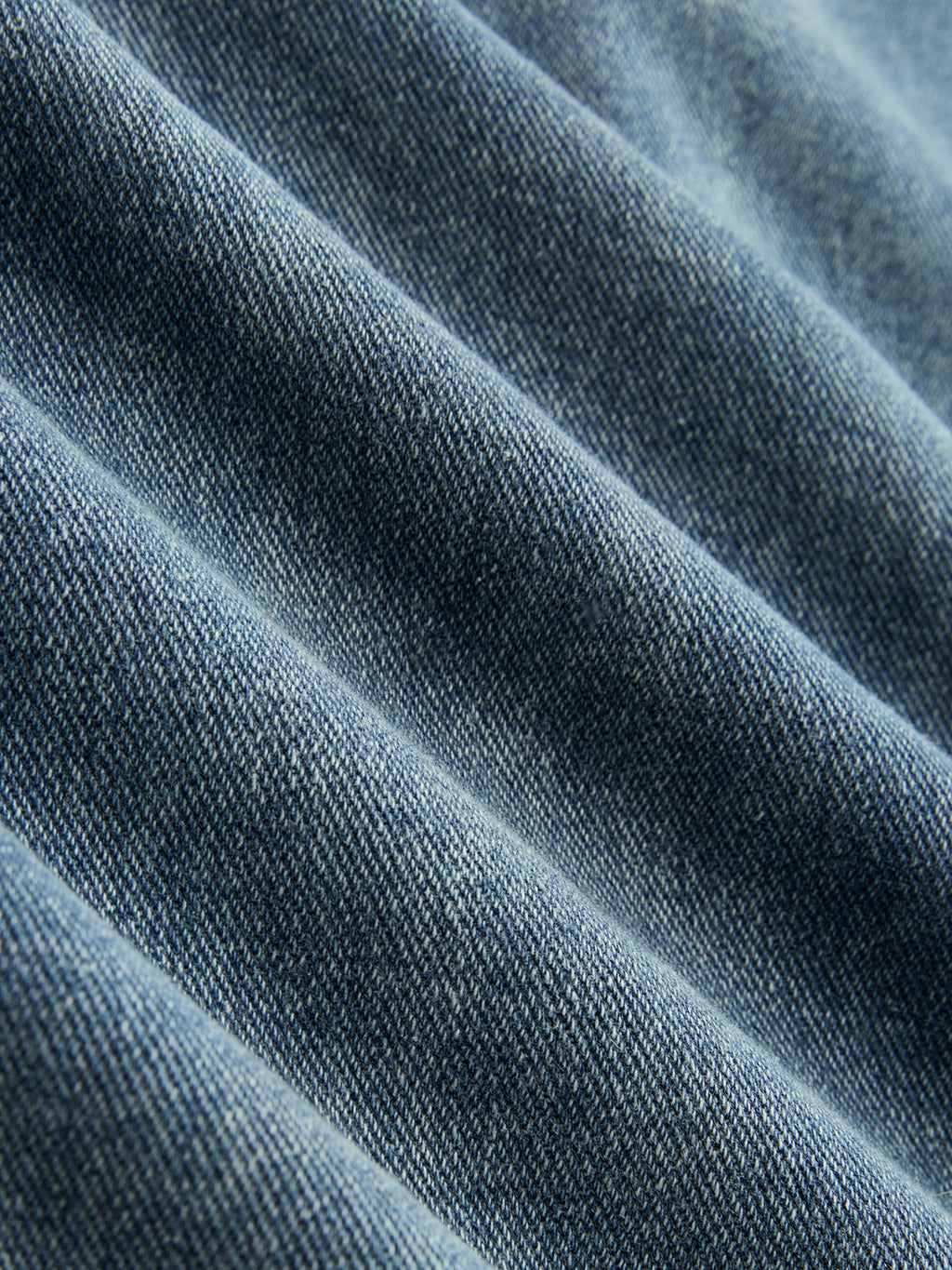 Pantalon en jean asymétrique à fronces et jambes larges