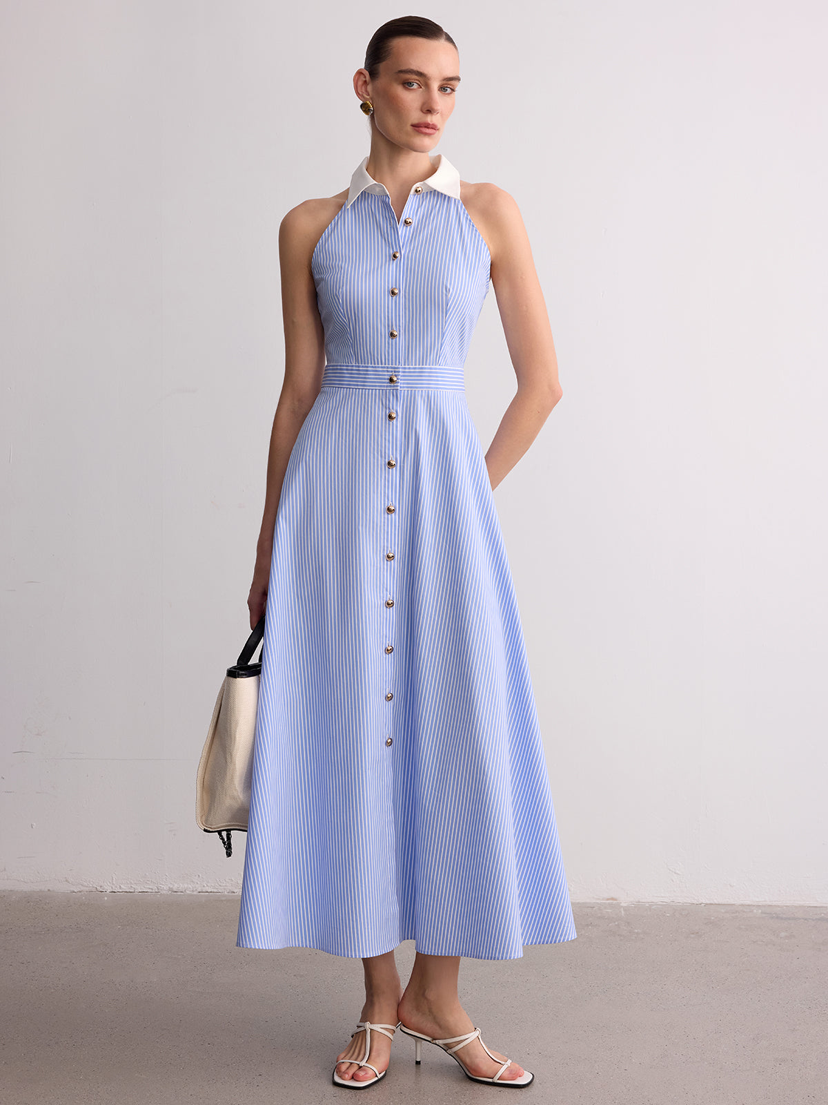 Robe longue boutonnée sans manches rayée à col
