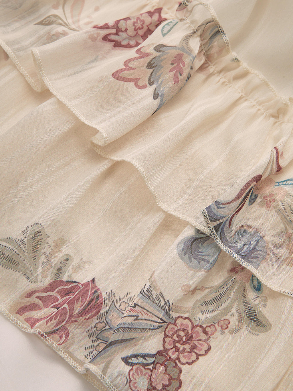 Mini-robe étagée en mousseline fleurie à volants