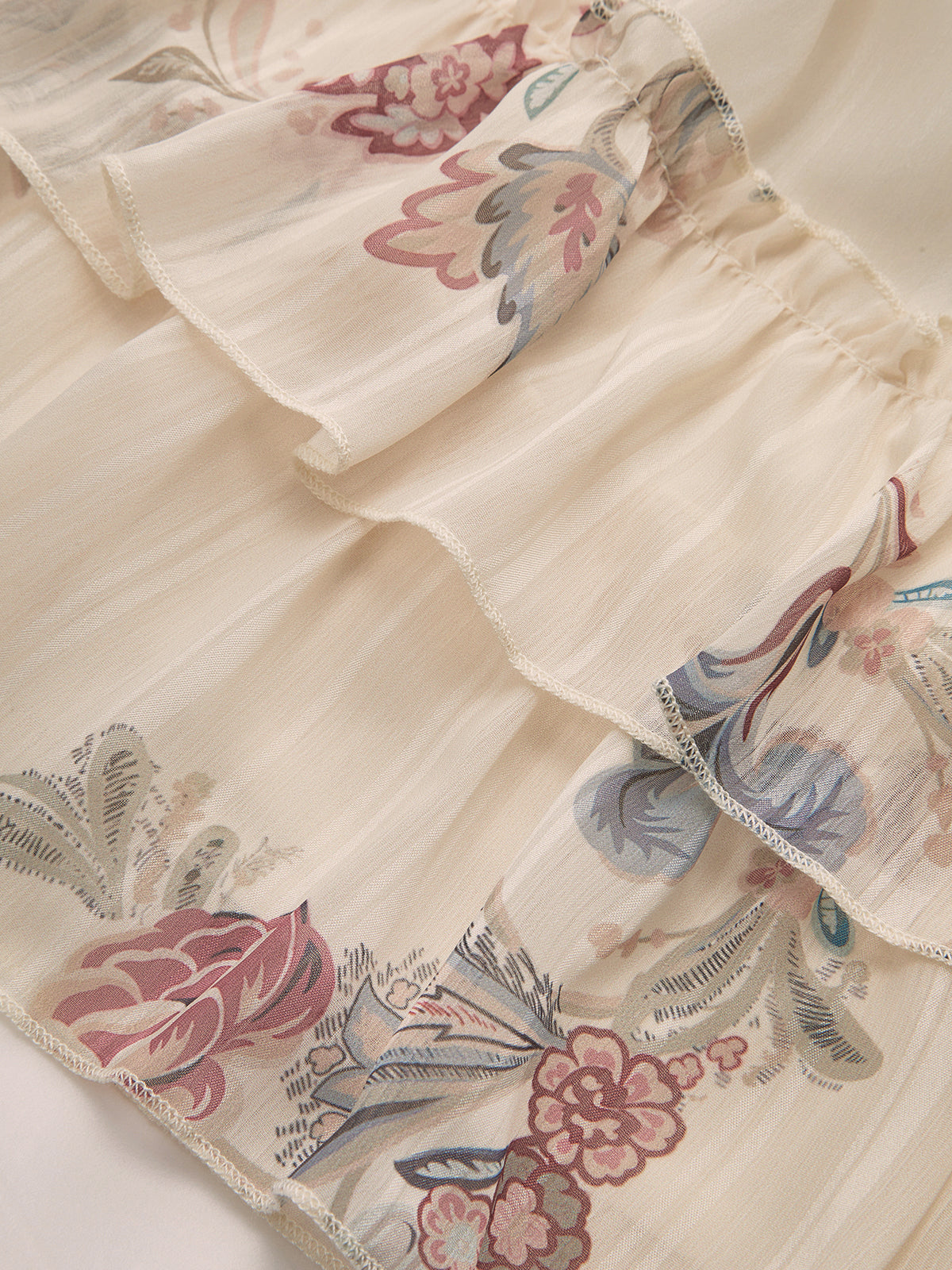 Mini-robe étagée en mousseline fleurie à volants