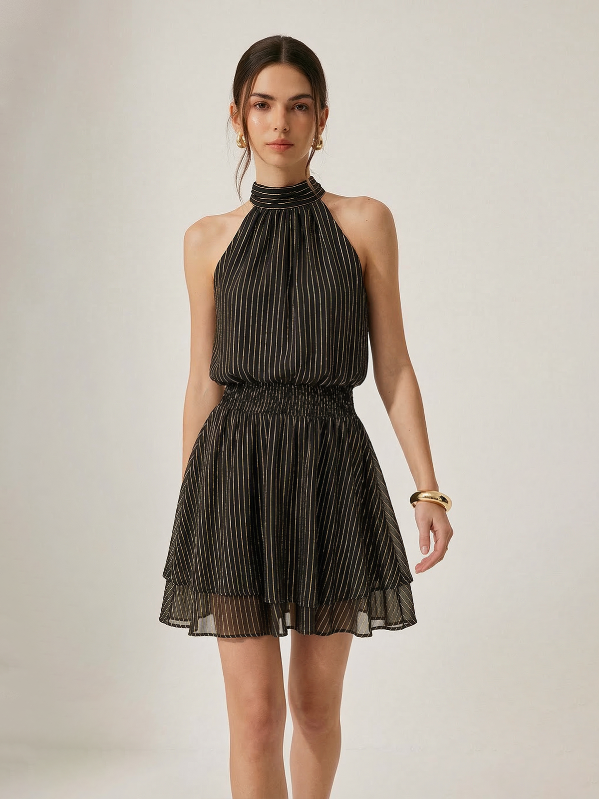 Mini-robe à rayures smockée et superposée à dos nu