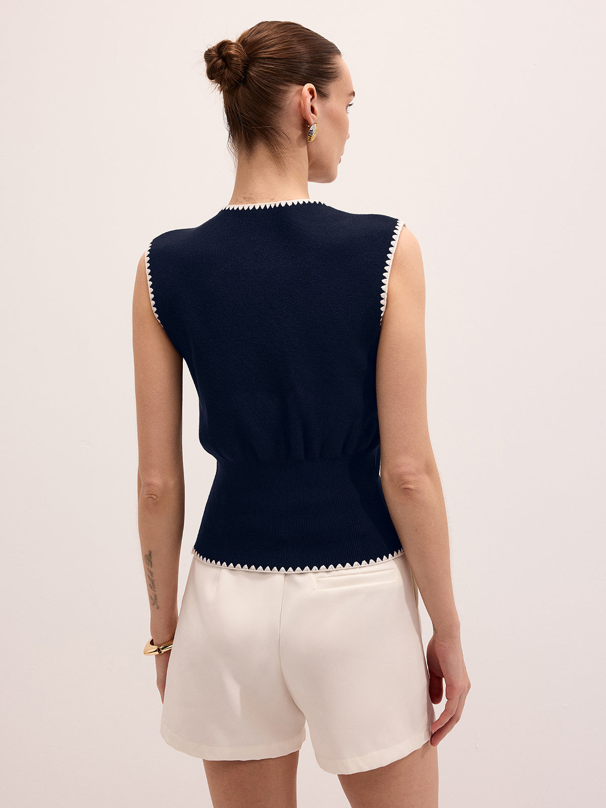 Gilet en maille avec fermeture métallique et garnitures contrastées