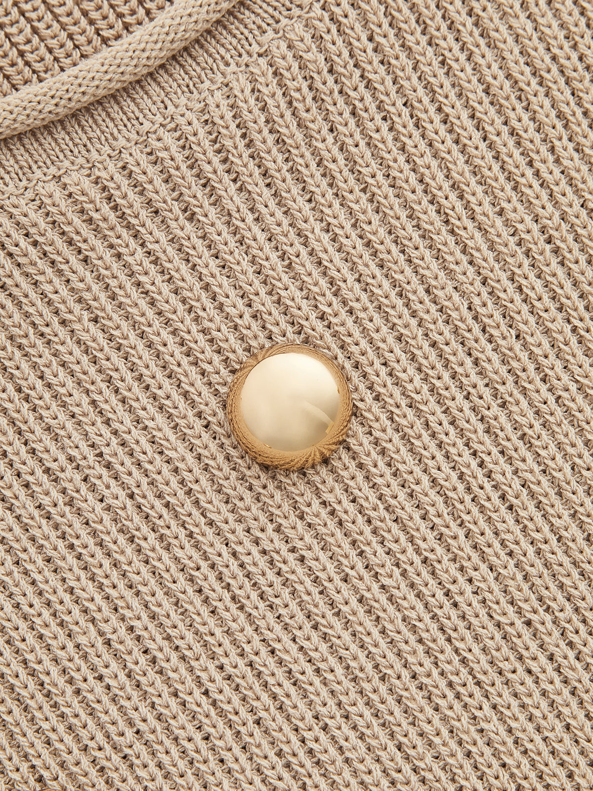 Gilet en maille orné de clous métalliques