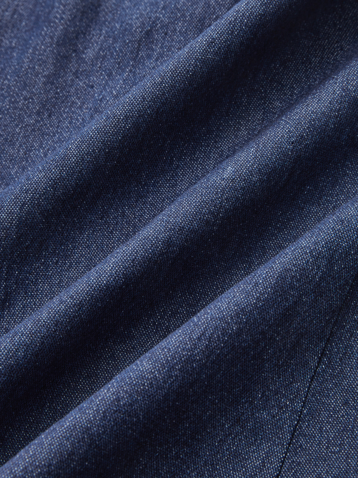 Haut ruché dos nu en jean à boutons métalliques